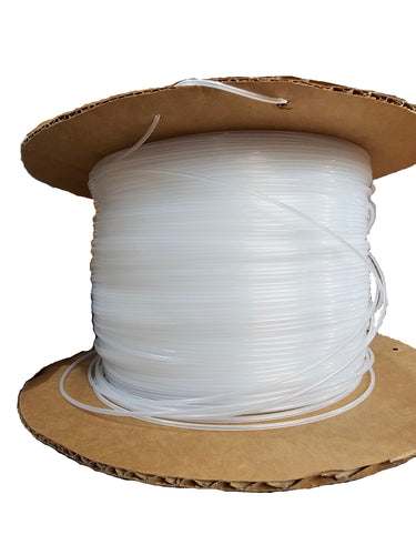 A spool of white plastic tubing on a cardboard holder on a white background.