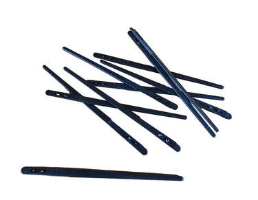 A collection of two prong lacing needles laid out on a flat white surface.