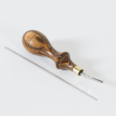 Montana Edger tool 2 by Ron's Tools with a metal tip and wooden handle, used for leatherworking and leathercraft creating fine edges on leather, displayed on a white background
