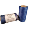 Two spools of royal blue hand sewing thread, one standing upright and the other lying horizontally, with packaging that includes the brand name and thread details.