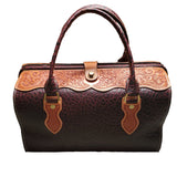 A brown leather doctor bag with a floral pattern and a rigid frame, displayed on a white background.