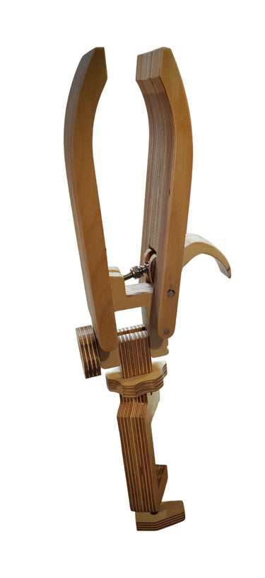 A wooden table top stitching pony with adjustable parts, placed on a white background.