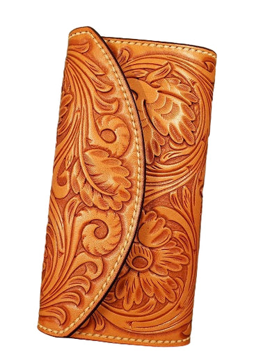 A brown leather clutch wallet with tooled floral patterns on the front and back.