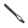 A quality metal punch tool lying on a white surface, stamped with the letters "Made in USA"
