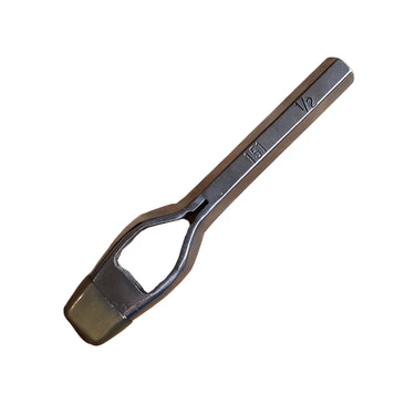 A quality metal punch tool lying on a white surface.