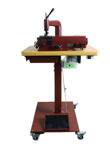 A red leather skiving machine on a metal frame with wheels, positioned on a light background.