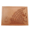 A tooling pattern featuring a skull and spider web design, embossed onto a leather material.
