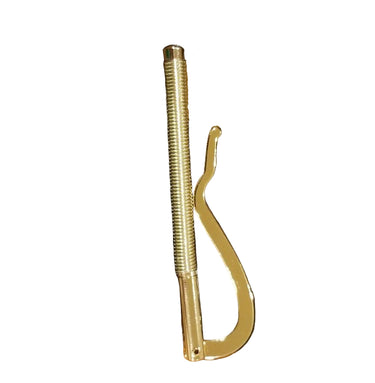 A gold-colored metal money clip with a spring mechanism, placed on a white surface.
