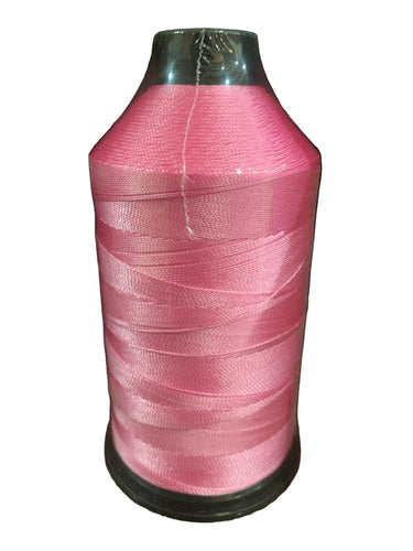 A spool of light pink bonded nylon thread