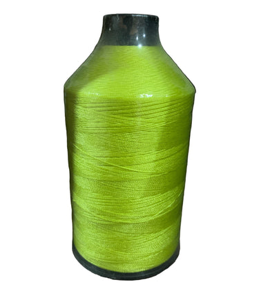 A spool of bright green nylon thread on a white background