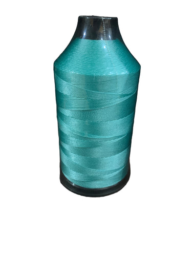 A spool of seafoam/pastel blue bonded nylon thread.