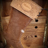 Custom made stocking with hair hide texture, and a tooled leather top section.