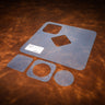 A set of blue acrylic templates used for creating a custom leather decanter set, laid out on a brown leather textured background. 
