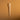 Clear plastic pipette on a brown textured background