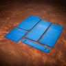 Set of blue foam pads on a brown leather surface