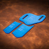 A set of blue acrylic templates used for creating a custom sheath for a slide knife. Laid out on a textured brown leather background. 