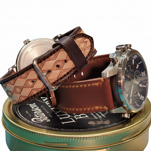 Watch with brown leather strap on a cylindrical gold and black container on a white background.