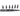 Black leather punch bit set with multiple bits on a white background