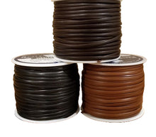 Load image into Gallery viewer, Three spools of leather lace in black, brown, and dark brown colors, placed on a wooden surface.