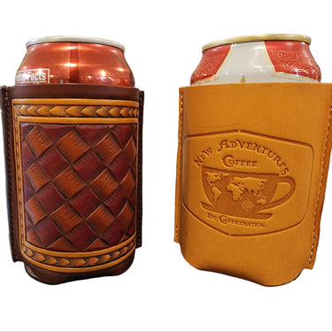 Two can cozies, one with a solid pattern in a darker color and one with a woven pattern in a lighter color, one featuring a coffee shop logo and the other with a tooled checker pattern.
